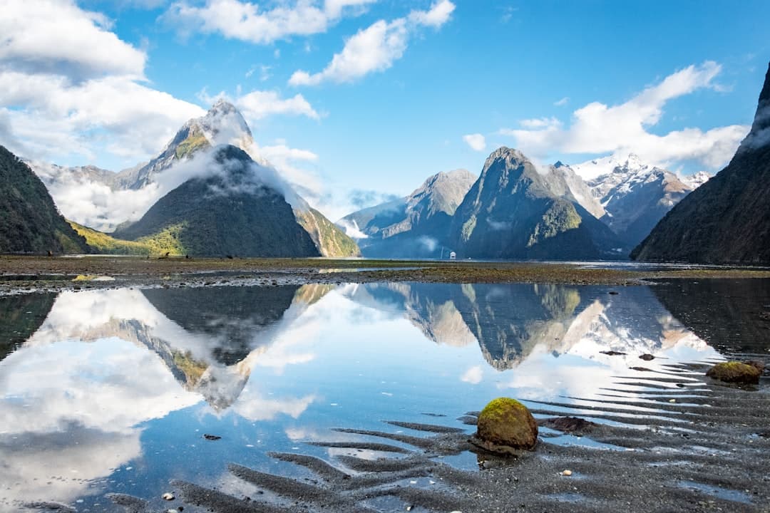 Mitre Peak and the mountains of Milford Sound reflected in still water